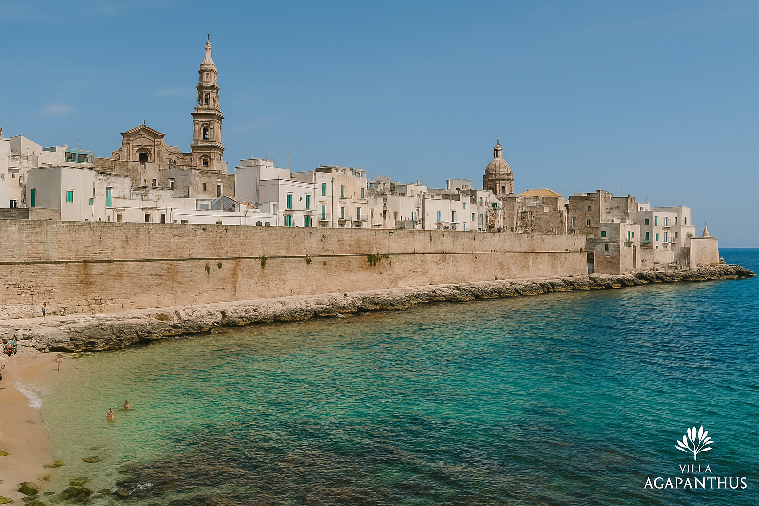 Vista panoramica di Monopoli con cielo azzurro e mare cristallino, ideale per una vacanza autentica in Puglia.